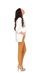 Wall Mural - side view of relaxed businesswoman looking up at something