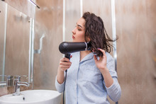 Beautiful Woman Drying Hair In Bathroom. Hair Care