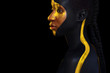 © Mike Orlov - Cheerful young african woman with art fashion makeup. An amazing woman with black and yellow paint makeup