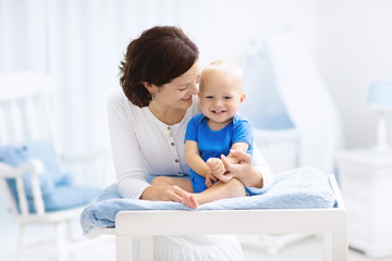 Mother and baby on changing table