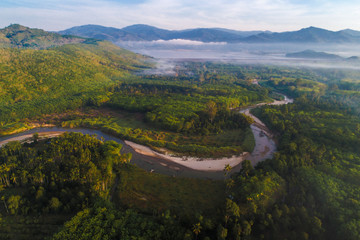 Bird eye view of river and deep rain forest in morning