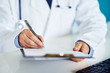 © Rostislav Sedlacek - Male doctor writes notes on the clipboard in medical clinic