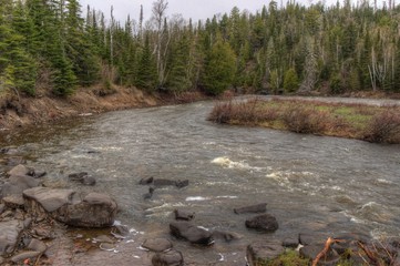 Wall Mural - The Pigeon River flows through Grand Portage State Park and Indian Reservation. It is the Border between Ontario and Minnesota