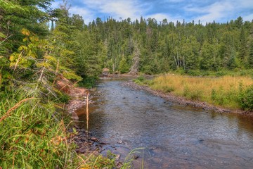 Sticker - The Pigeon River flows through Grand Portage State Park and Indian Reservation. It is the Border between Ontario and Minnesota