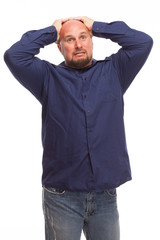 Wall Mural - Man looking stressed on white background.