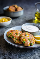 Sticker - Tuna Fish cakes with green peas, corn and scallion served with sour cream dip
