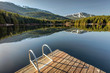Early morning sunlight on the dock at Lost Lake in Whistler, British Columbia, Canada
