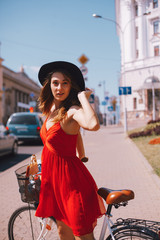 Wall Mural - Woman with bike on the street