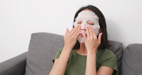 Poster - Woman apply skincare mask on face at home