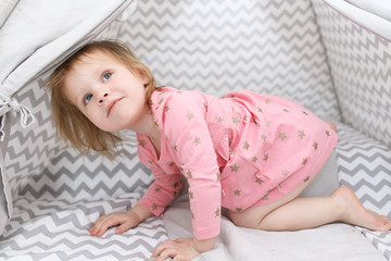 funny happy 2 years little girl in wigwam tent