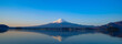 Panorama Reflection of Fuji mountain with snow capped in the morning Sunrise at Lake kawaguchiko, Yamanashi, Japan. landmark and popular for tourist attractions