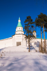 The fortress walls with towers around the New Jerusalem Monastery of the 17th century. Istra, Moscow suburbs, Russia.