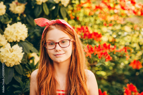 Close Up Portrait Of Adorable Red Haired Kid Girl Wearing