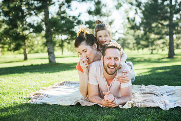 Wall Mural - Happy family rest in park.