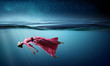 © Sergey Nivens - Woman dancer in clear blue water