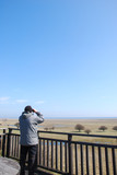 Fototapeta  - Bird watcher in a tower by a great wetland