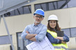 © goodluz - Construction engineers meeting outside building