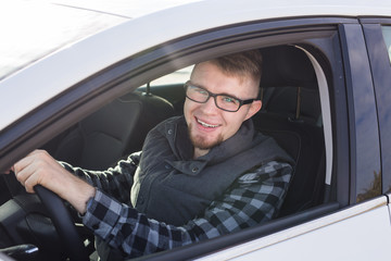 Young man test drive new car.