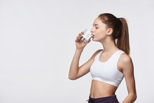 Sporty Teen Girl Drinking Clear Water With Closed Eyes
