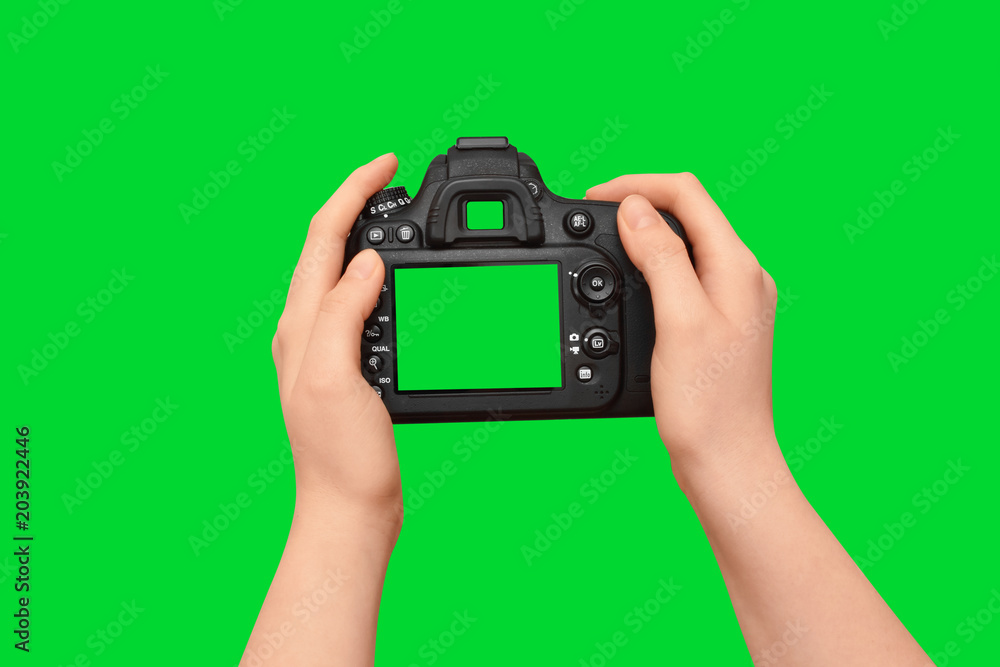 Female hands holding dslr camera with empty screen, isolated on green ...