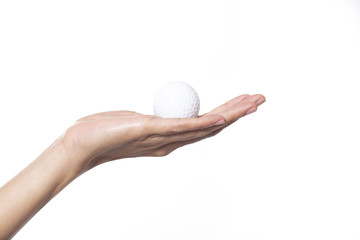 Golf ball in woman hand isolated on white background