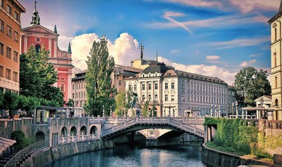 Wall Mural - View on Ljubljanica river with old building in Ljubljana city in Slovenia.