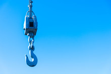 Metal Industrial Crane Hook On Blue Sky Background