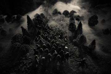 War Concept. Military silhouettes fighting scene on war fog sky background, World War Soldiers Silhouettes Below Cloudy Skyline At night. Attack scene. Selective focus Tanks battle. Decoration