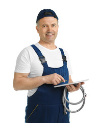 Wall Mural - Mature plumber with tablet computer and hose on white background