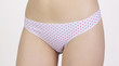 © Max - White bikini with pink polka dots.