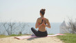 © tol_u4f - Young beautiful woman practicing yoga on the beach at sunny day. Healthy active lifestyle concept