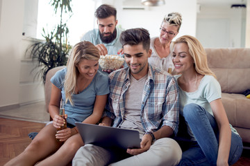 Poster - Happy friends with laptop watching football game