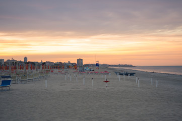 Wall Mural - Typical beach of the Romagna Riviera at sunset.
