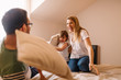 © Nebojsa - Happy family is having pillow fight in bed at home