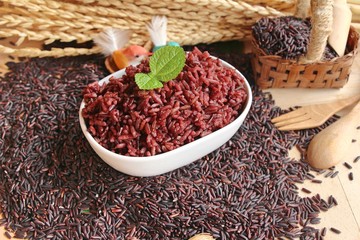 Wall Mural - cooked black rice and raw organic riceberry rice