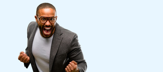 Wall Mural - African american man with beard happy and excited celebrating victory expressing big success, power, energy and positive emotions. Celebrates new job joyful isolated over blue background