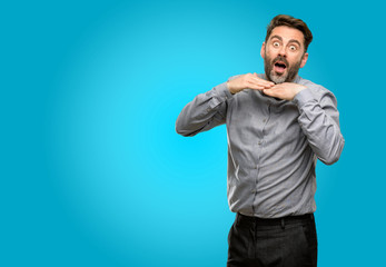 Canvas Print - Middle age man, with beard and bow tie happy and surprised cheering expressing wow gesture