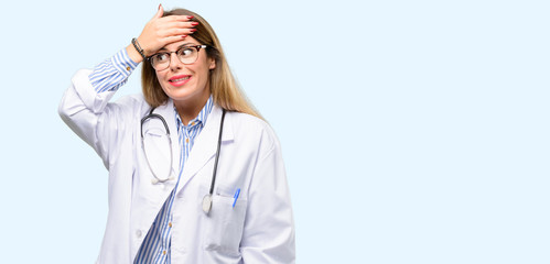 Wall Mural - Young doctor woman, medical professional terrified and nervous expressing anxiety and panic gesture, overwhelmed