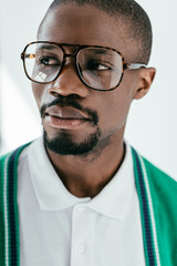 Wall Mural - portrait of handsome african american man in fashionable glasses, isolated on white