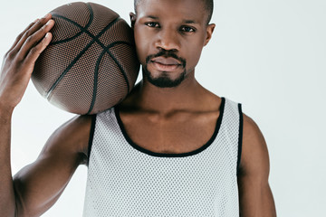 Wall Mural - athletic african american man with basketball ball, isolated on white