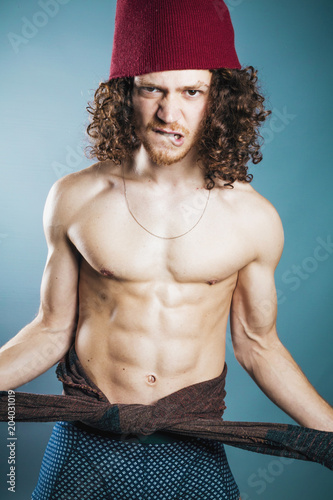 Attractive Young Man With Long Ginger Curly Hair Posing With