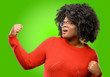© Krakenimages.com - Beautiful african woman happy and excited celebrating victory expressing big success, power, energy and positive emotions. Celebrates new job joyful
