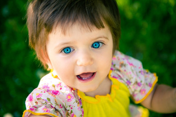  little girl in summer in the park. Portrait of a cute little girl in summer. Children's Day June 1. The first day of summer
