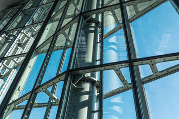 Poster - The glass architecture in city against a sky