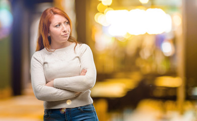 Sticker - Beautiful young redhead woman irritated and angry expressing negative emotion, annoyed with someone at night