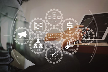 Wall Mural - success businessman hand using smart phone,digital tablet docking smart keyboard on wood desk