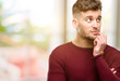 © Krakenimages.com - Handsome young man thinking and looking up expressing doubt and wonder