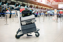Suitcase Or Baggage With Airport Luggage Trolley In The International Airport.