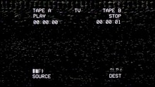 A Black Old Damaged VHS Tape Sceen Tracking A Noisy Bad Signal From A Double Deck. Cool Retro Vintage Backdrop For Modern Videos.
