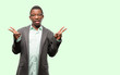 © Krakenimages.com - African black man wearing jacket looking at camera showing tong and making victory sign with fingers